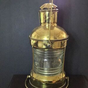 Lamp, antique, brass, and glass hurricane lamp from Royal. USCO